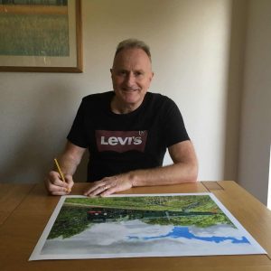 Nigel Wade signing his original painting of Sir Keith Park